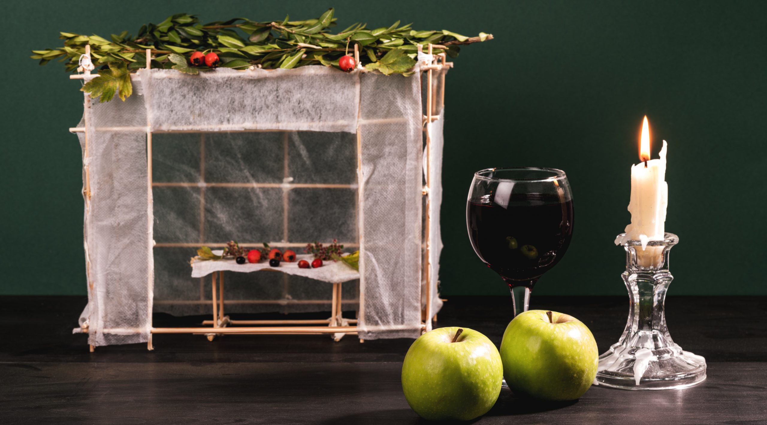 hut made of paper covered with leaves. Happy Sukkot.